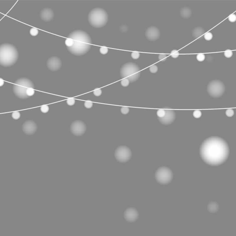 White fairy lights on grey background.